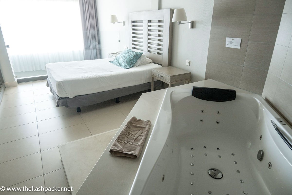 hot tub and bed in room at hd beach hotel costa teguise lanzarote