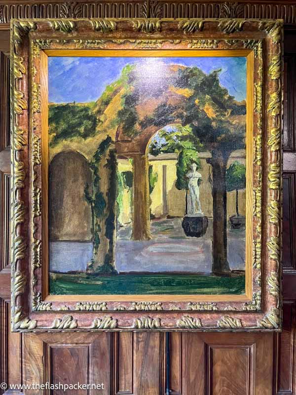 oil painting of a garden and classical statue seen through an arch