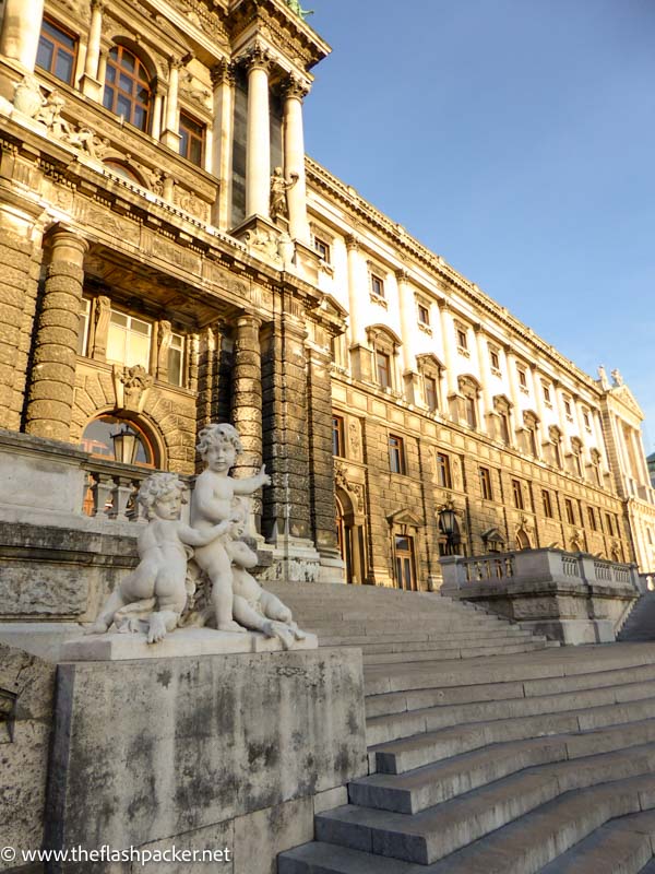 front of baroque palace building in vienna