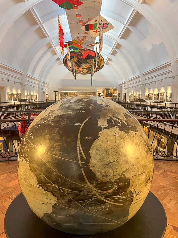 giant globe in front of a gallery