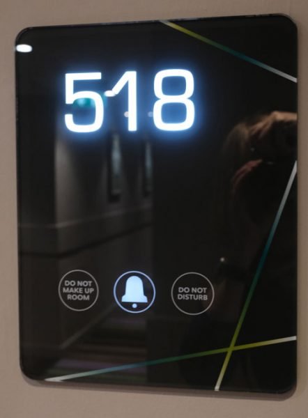 illuminated hotel room sign with the number 518