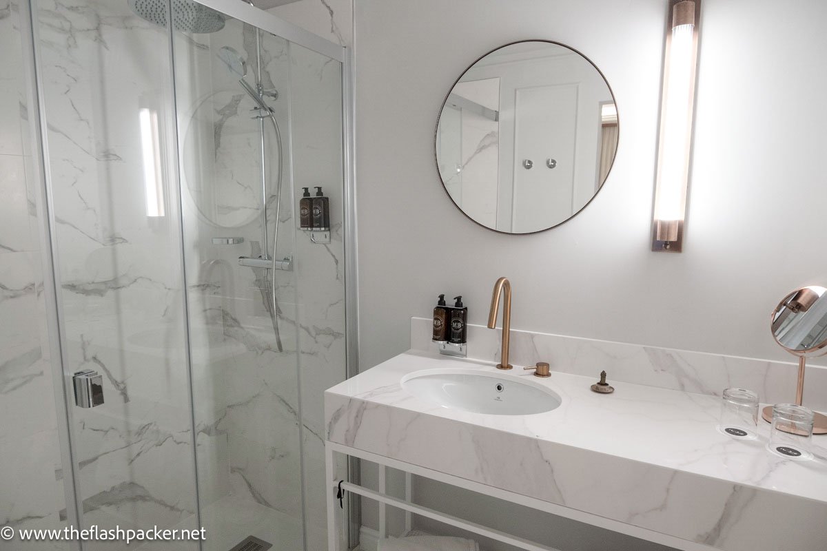 shower and marble sink in hotel bathroom in malaga spain