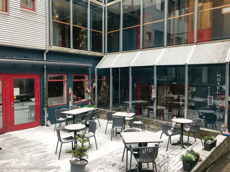 courtyard with tables and chairs at hotel fron in reykjavik