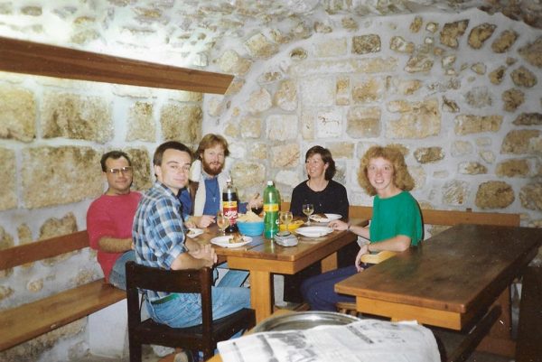 group of people eating sitting around table