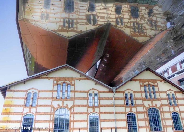 upside down reflection of gab;ed building in krakow poland