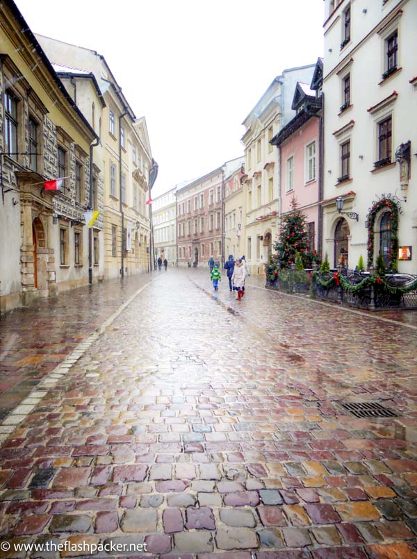 cobblestone street in the rain seen during 4 days in krakow poland