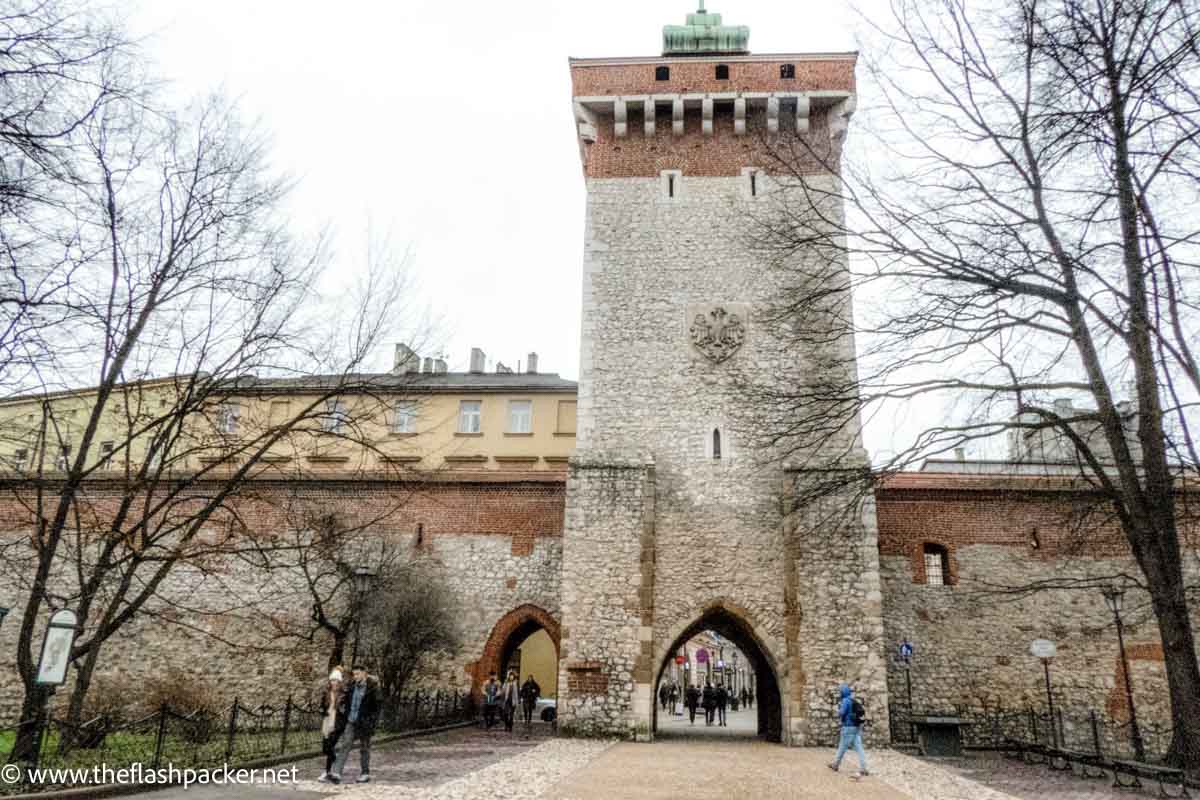 old gate to walled city at start of krakow walking tour