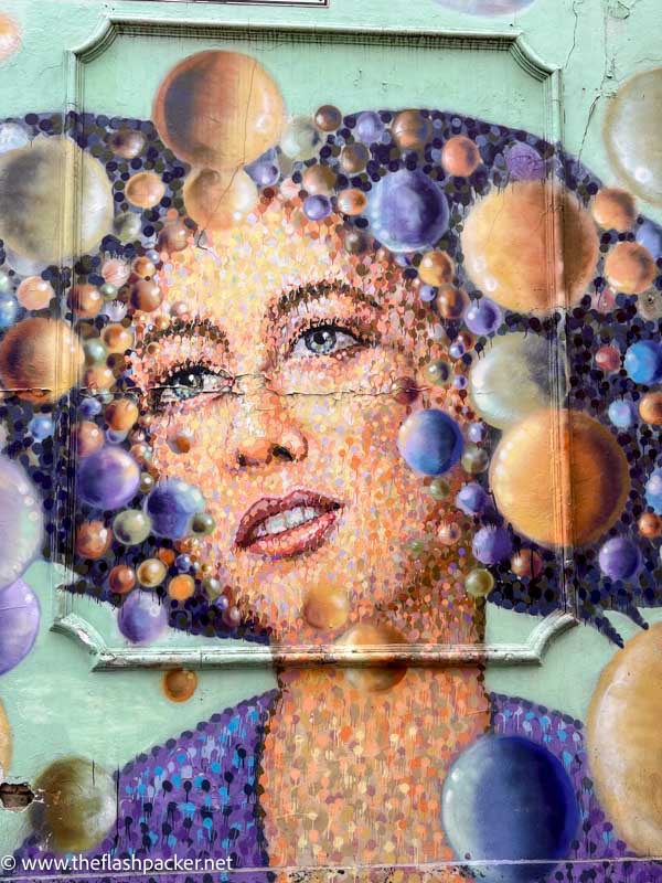 mural of a lady surrounded by coloured bubbles