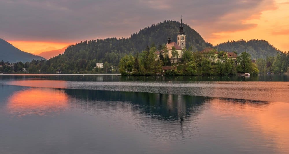 photographing this sunrise over the lake is one of the best things to do in lake bled slovenia