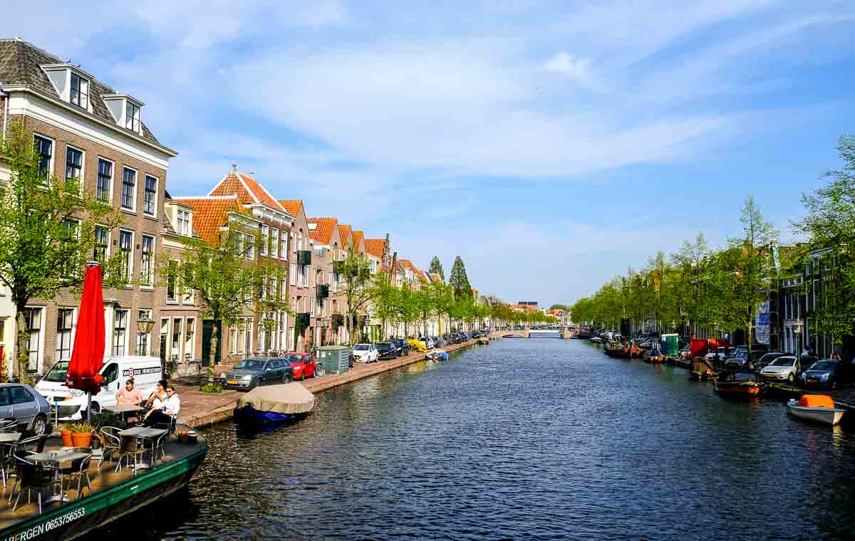 canal with buildings on each side an a boat moored