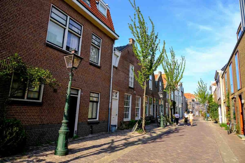 3 women walking along a pretty street in leiden netherlands