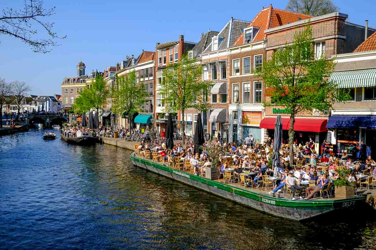 busy bars along a canalside in leiden