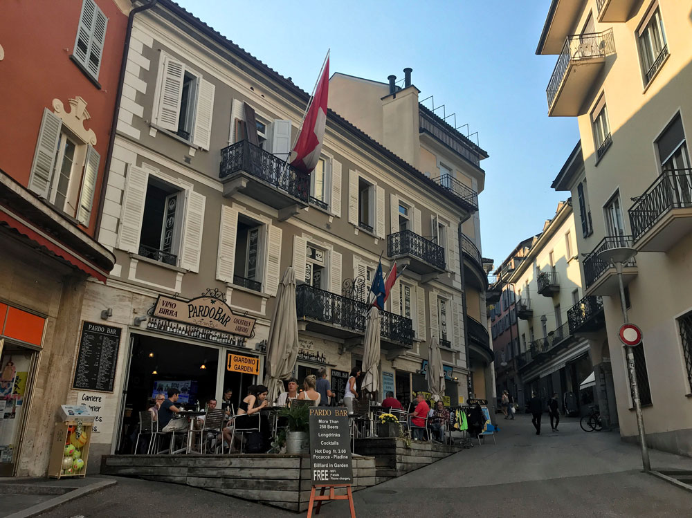 poeple drinking on pavement outside cafe in locarno switzerland