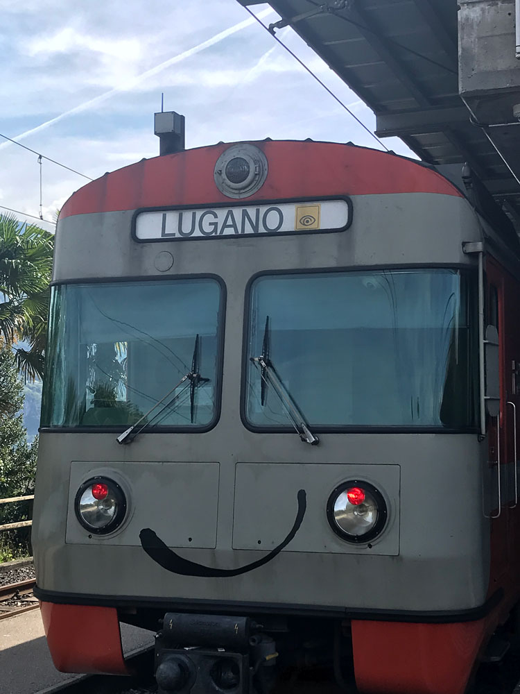 swiss train that can be used with the ticino ticket with a smiley face painted on front