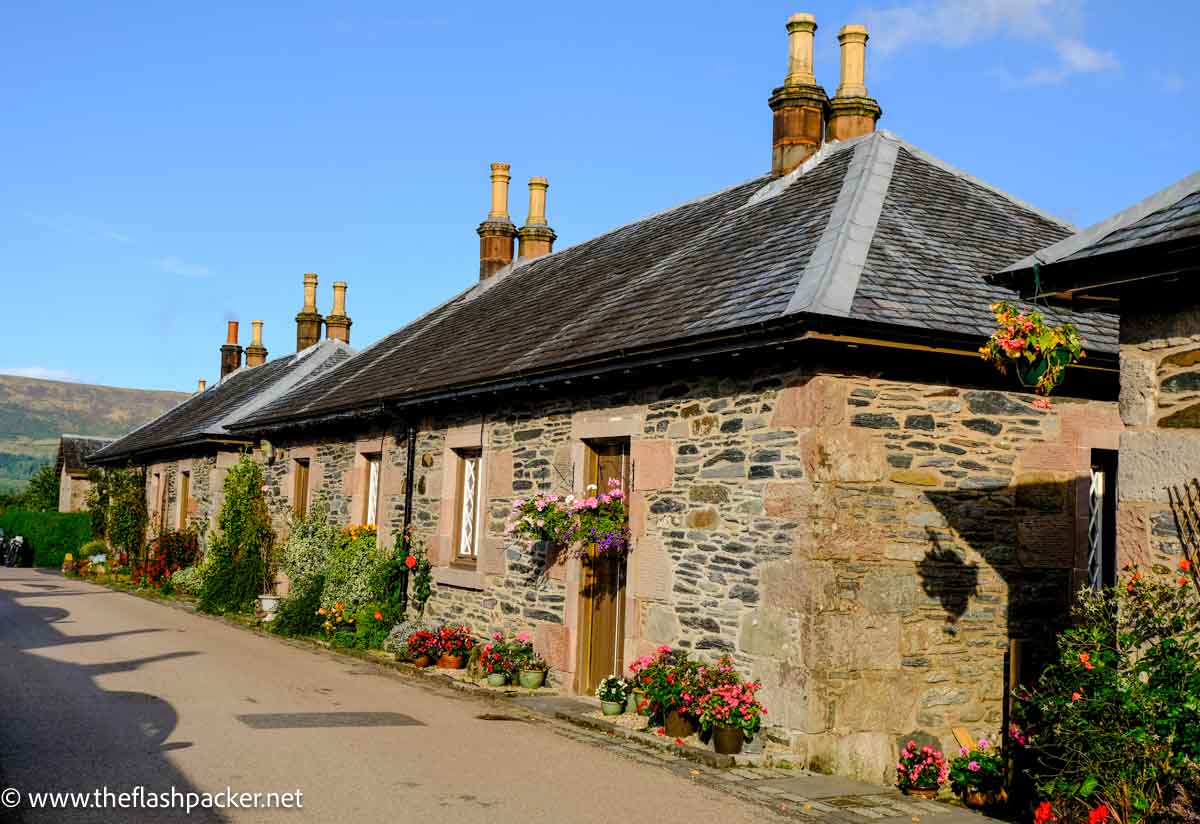 row of pretty cottages under blue sky