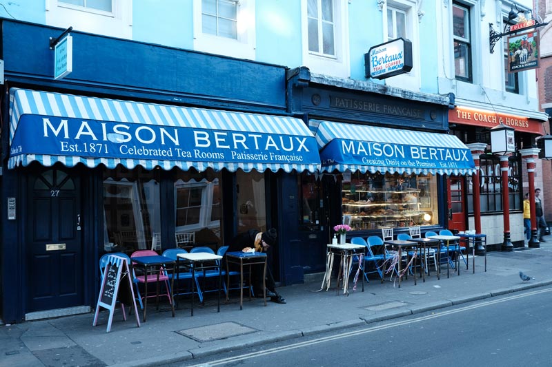 blue awnings of exterior of maison bertaux in london