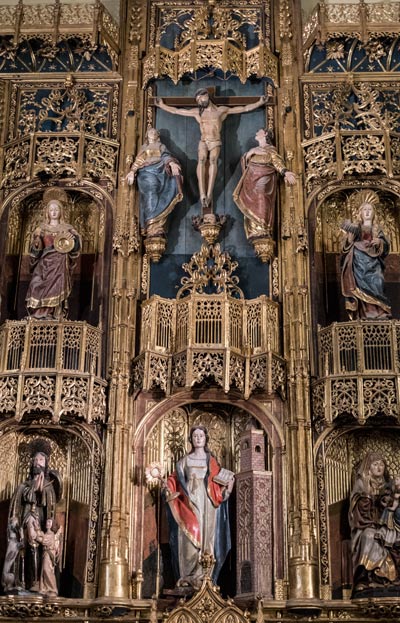 ornate gilded altar with sculptures of saints