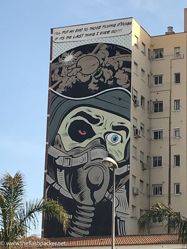 malaga street art of man in gas mask