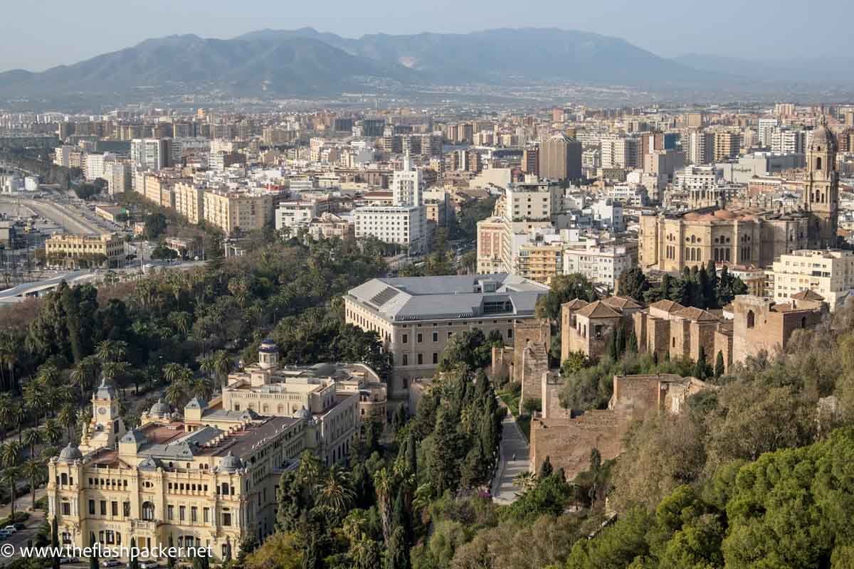 panoramic views of rooftops of malaga and mountains beyond from the gibralfaro