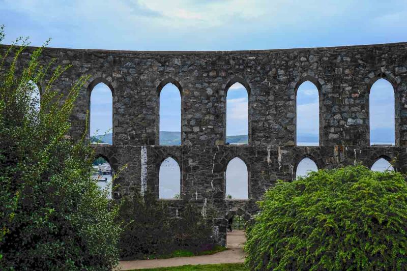 arches of mccaigs-tower-oban with bay in background