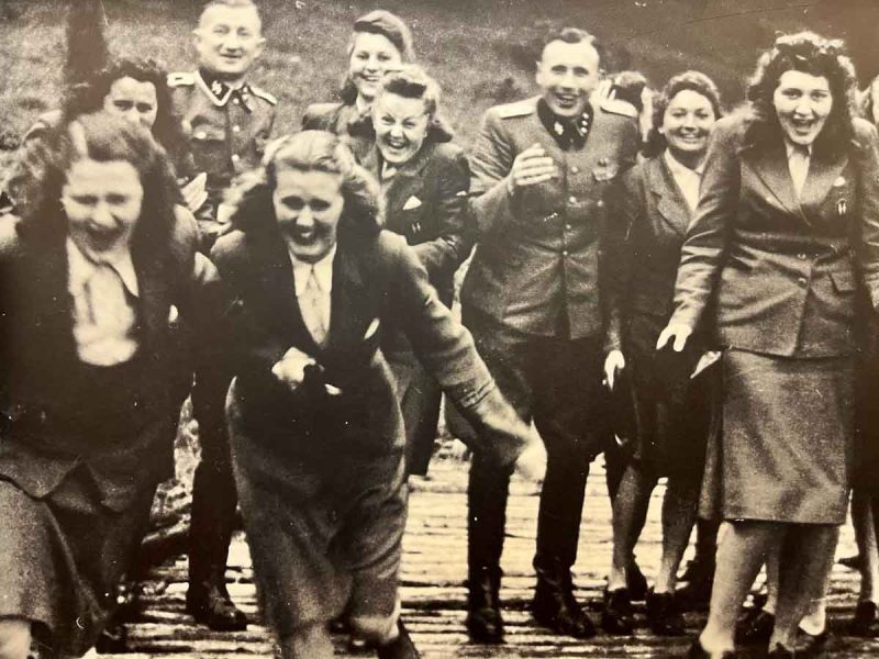 black and white photo of a group of people enjoying a day out