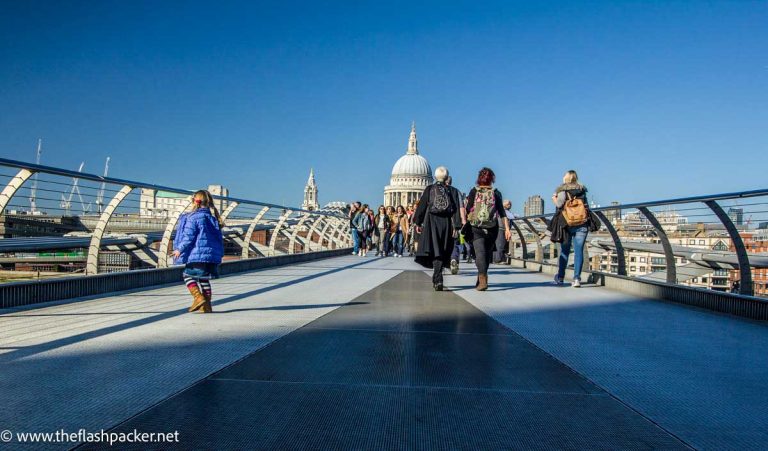 lookinf across millennium bridge to st pauls cathedral in london