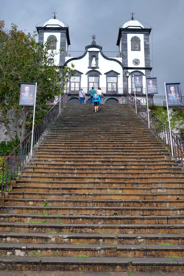 monumental set of steps leading to a white and grey church with 2 bell towers