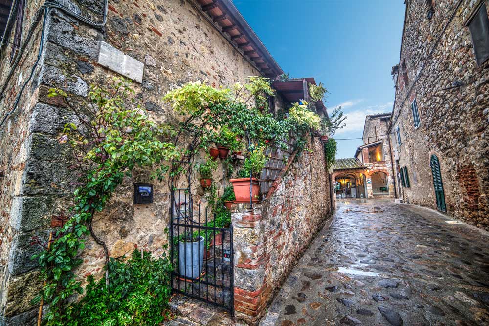 pretty street in a tuscan village at dusk