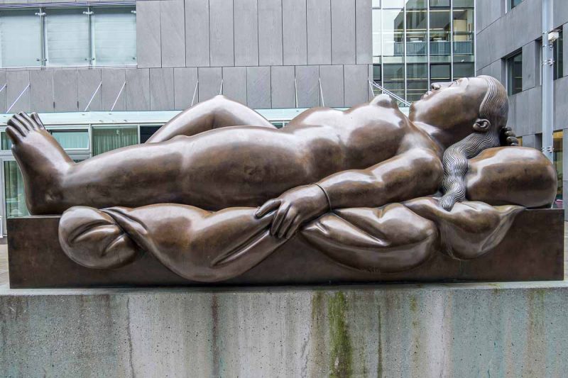 bronze sculpture of nude declining woman