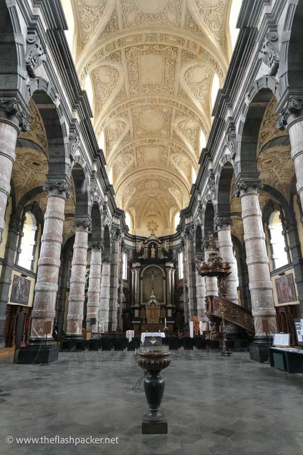 nave of a baroque church with classical columns and arches