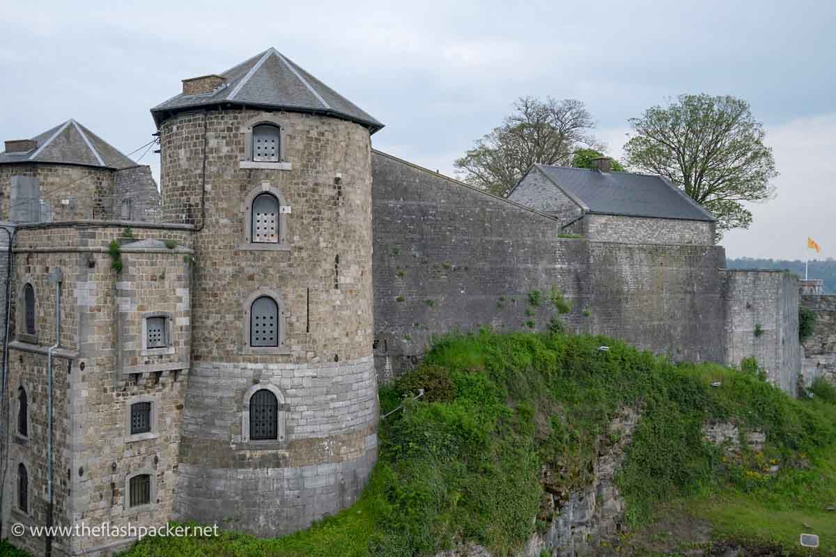 grey stone walls and turret of citadel in namur