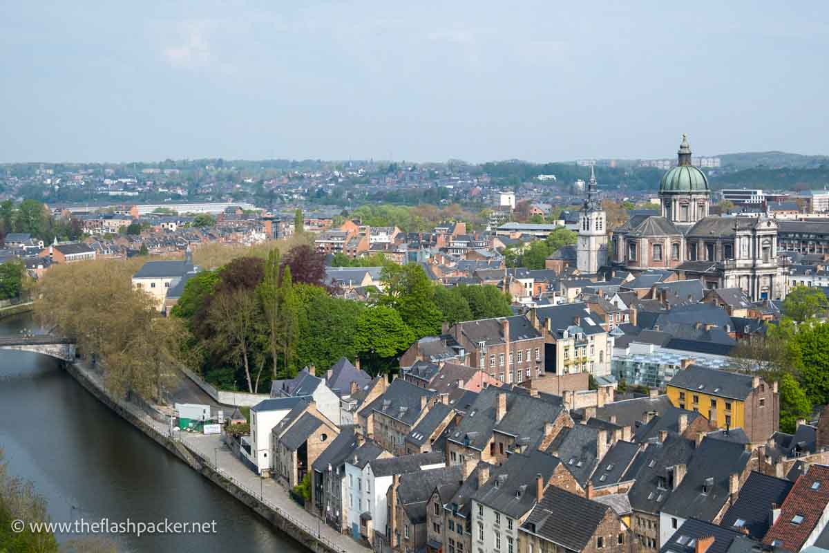 panoramic view of namur with river, cathedral dome and belfry