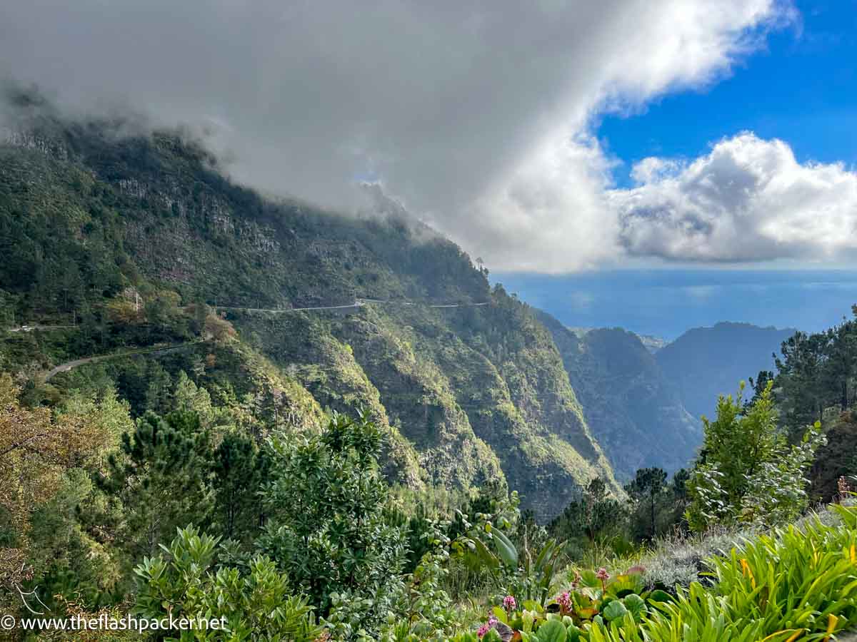 road winding its way along side of deep lush valley in the nuns valley madeira