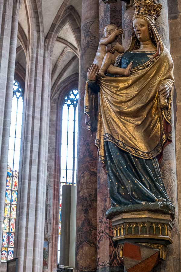 statue of madonna and child inside gothic church