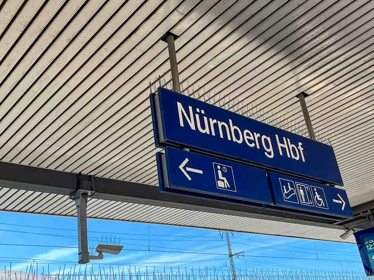 sign for nürnberg on platform of the train station