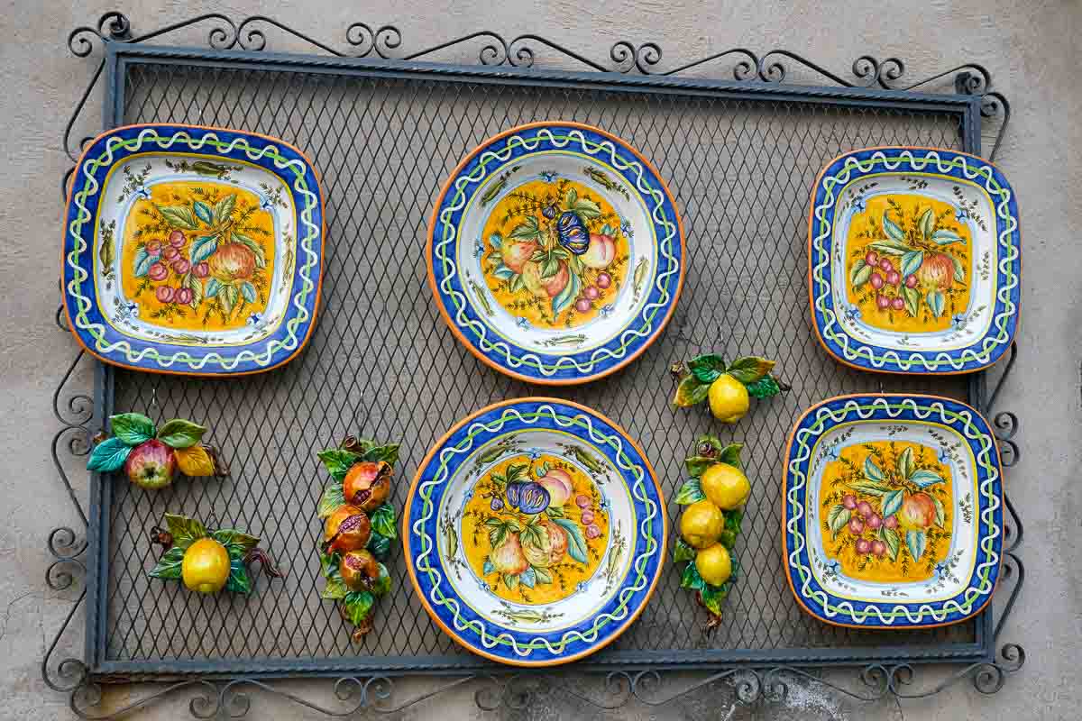 wall display of blue and yellow ceramics