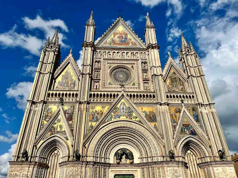 glittering multicolour mosaics on the facade of orvieto cathedral in italy