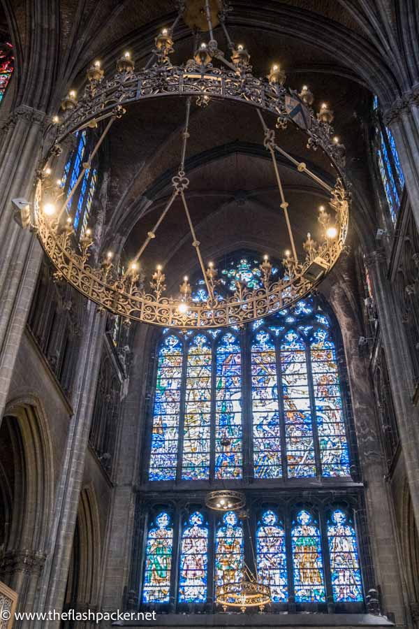 interior of cathedral with stained glass windows and lights arranged as crown of thorns