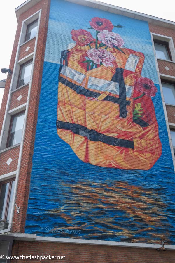 massive wall mural of flowers in a backpack