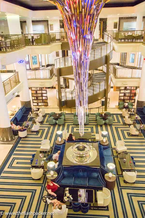 people sitting in atrium of cruise ship p and o britannia