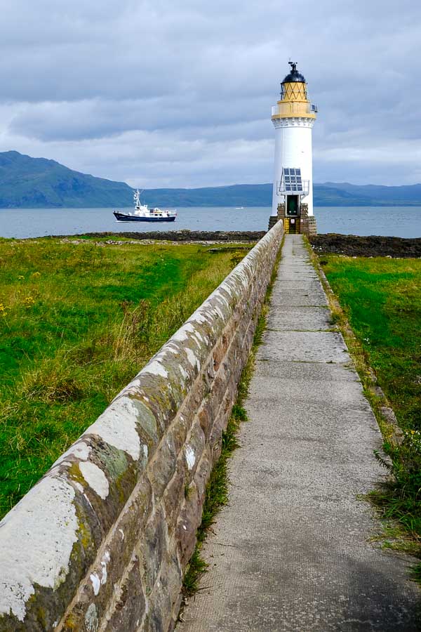 long path leading to a lighthouse on mull scotland