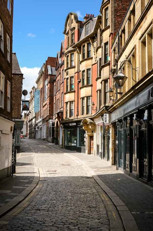 narrow street with georgian buildings in newcatle upon tyne