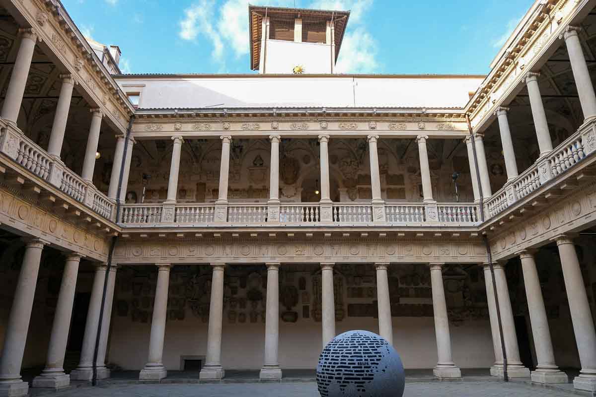 two-level porticoed courtyard with a ball at the centre at palazzo bo in padua