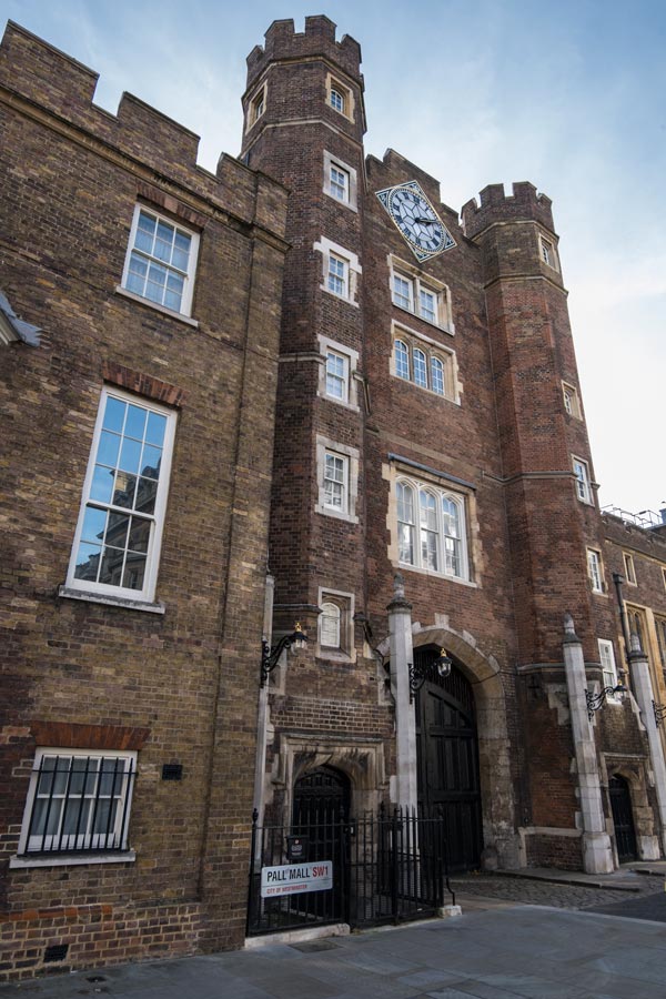 red brick gateway of st james palace with clock