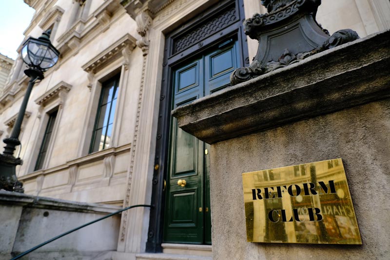 brass plate and entrance of the reform club in london