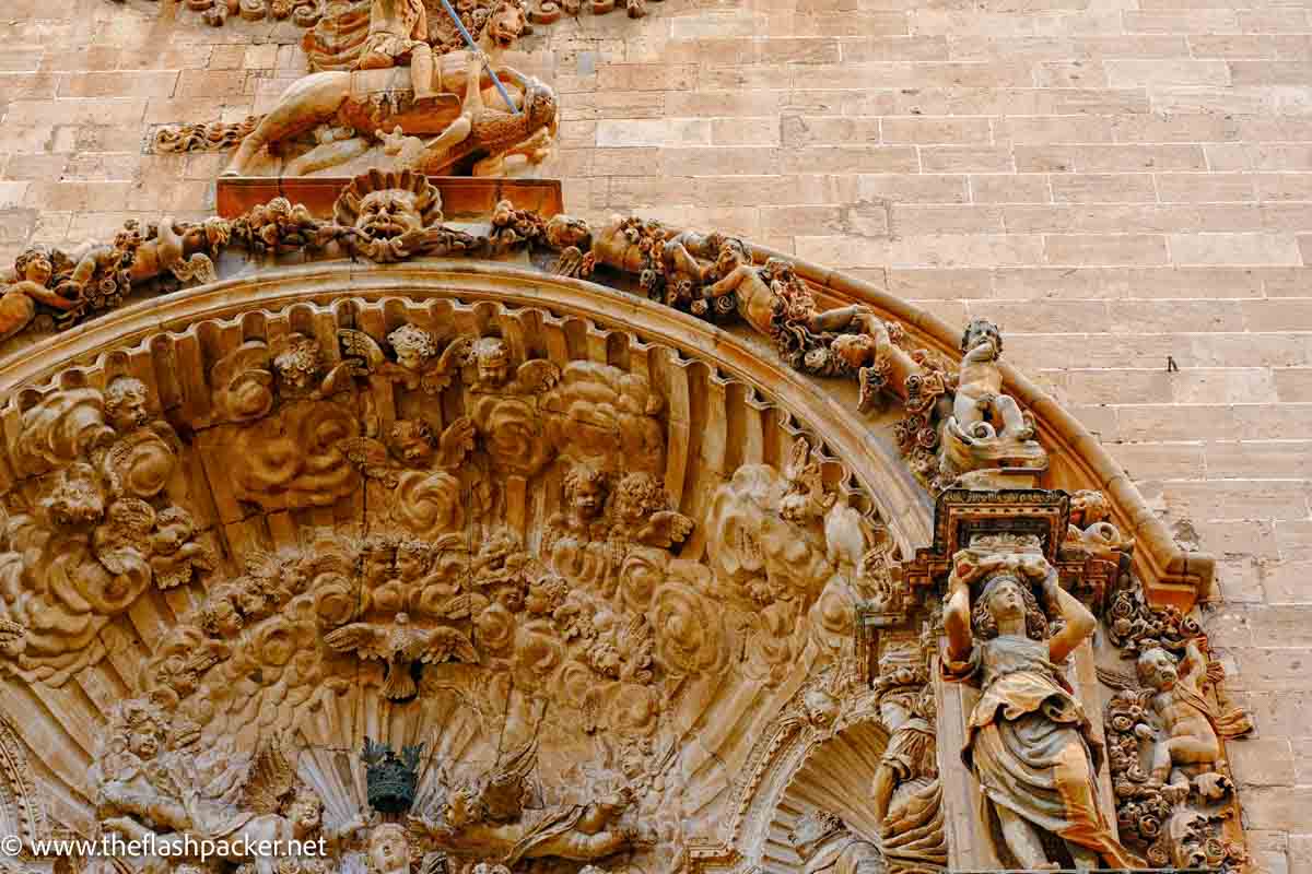 elaborately carved doorway of church in palma de mallorca spain