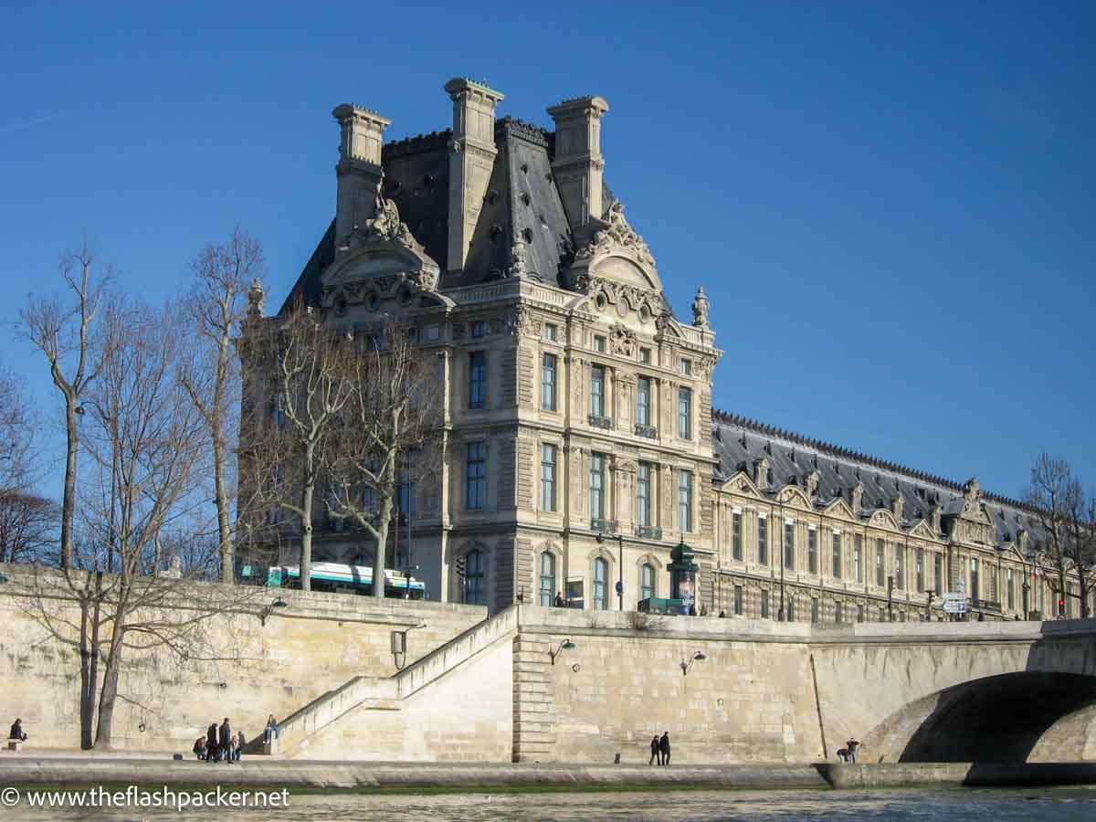 large elegant building by the side of the river in paris france