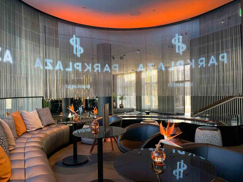 bar area of park plaza hotel in budapest with curved sofa and tables and chairs