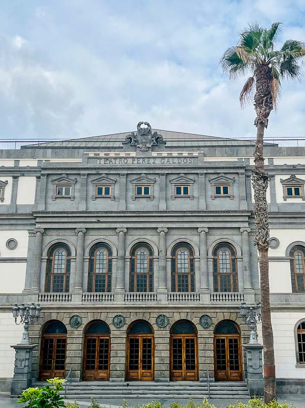 grey and white neo-classical exterior of perez galdos theatre in las palmas de gran canaria