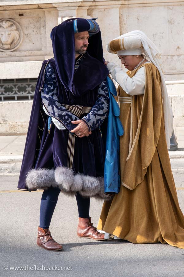 a man and woman in medieval costume